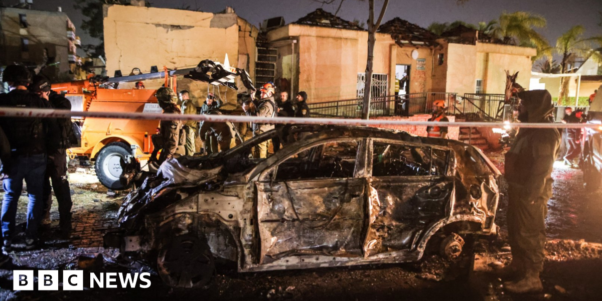 Iranian missile strikes near Israeli nuclear facility, after Tehran says one of its sites targeted - live updates