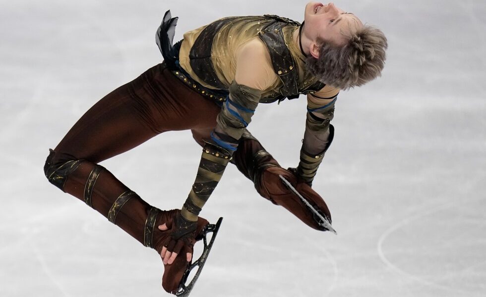 Malinin rebounds from Olympics at the worlds with a personal-best short program