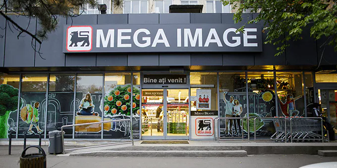 Mega Image atinge pragul de peste 1.000 de magazine în 2026, după patru ani de efort de extensie a rețelei Retail-ul din România înregistrează un nou prag important în ceea ce privește expansiunea lanțurilor de supermarketuri și magazine de proximitate
