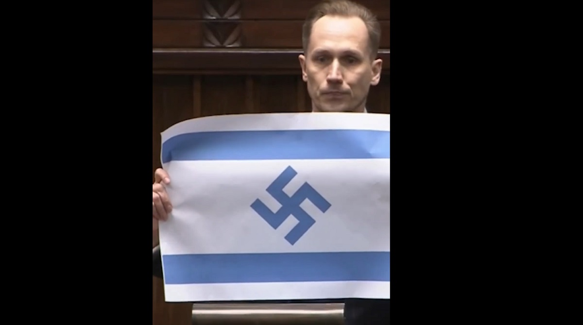 Deputat extremist, șoc în Polonia: steag israelian cu svastică în Parlament
