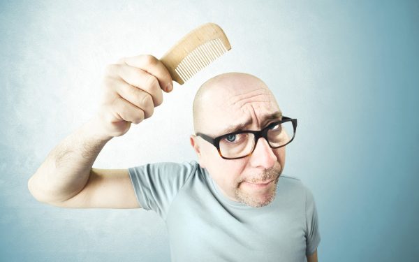 Roșcații și bărbații fără păr, avantajați de selecția naturală. Studiu ADN